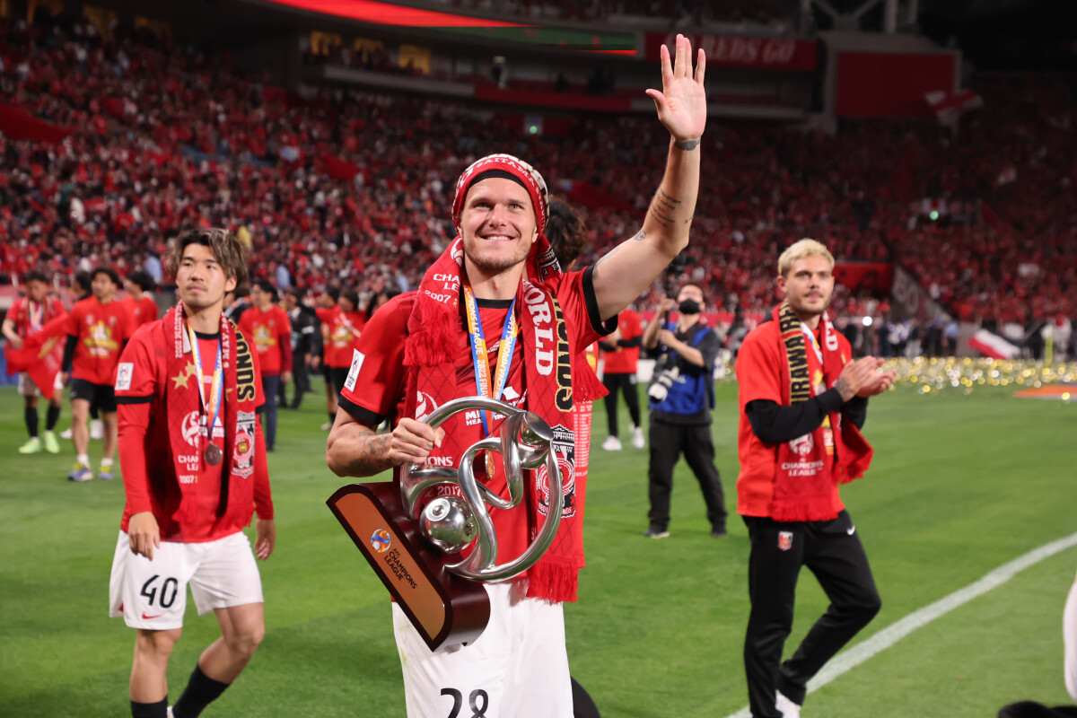 Urawa Reds' Alexander Scholz acknowledges fans after the 2023 J1