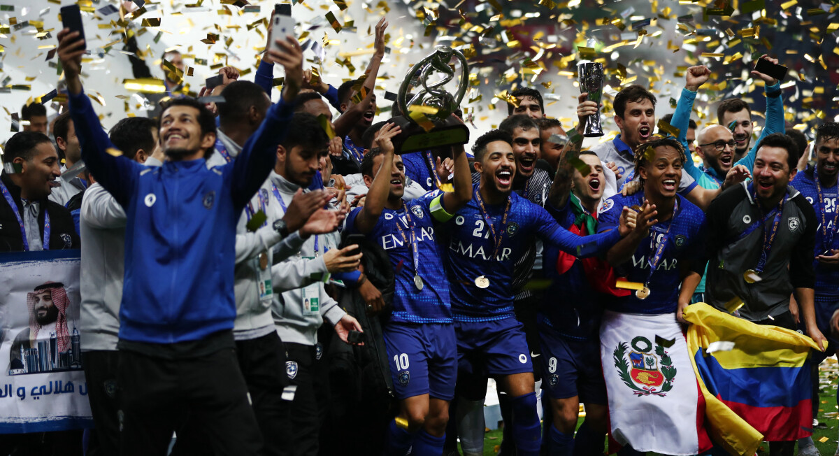 Saudi Arabia's Al Hilal soccer team players celebrate their trophy of the  AFC Champions League 2021 after the team beats South Korea's Pohang  Steelers 2-0 during their final soccermatch at the King