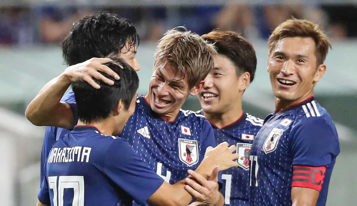 Japan's defender Sho Sasaki (C) celebrates his team's first goal with ...